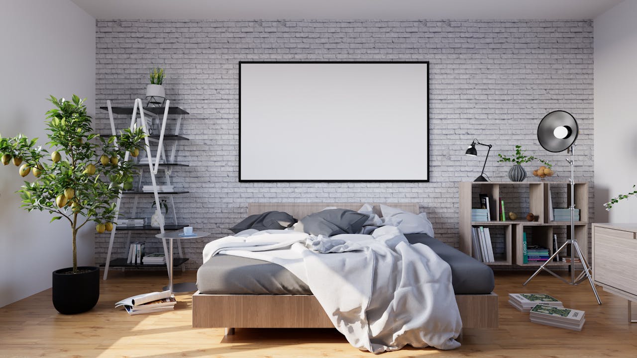 Stylish modern bedroom with minimalist decor, featuring a brick wall and natural lighting.